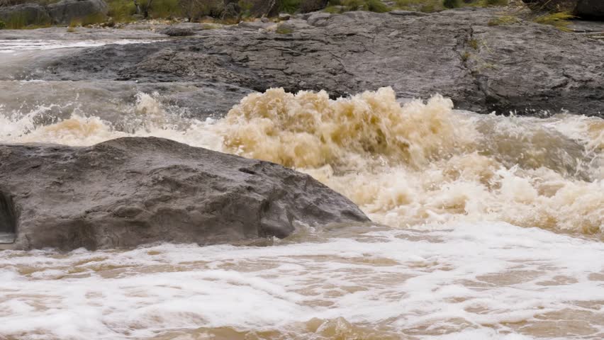 Heavy Flood waters and rapids channel through rocky terrain during floods at Pedernales Falls State Park in Texas. Flooding from October 2018, south of Austin, Texas. Panning left to right with flow