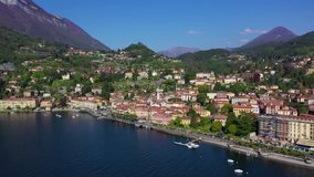 Aerial drone video of iconic village of Menaggio in lake Como one of the most beautiful and deepest in Europe, Lombardy, Italy
