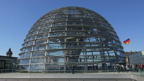 BERLIN/Germany, April, 2019: Visitors inside the famous Reichstag glass dome building, on the top of the Reichstag, designed by architect Norman Foster, one of Berlin's most important landmarks
