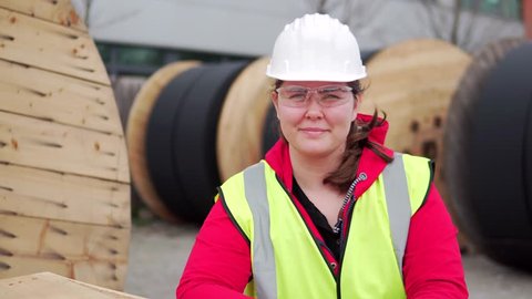 Стоковое видео: Portrait Of A Hard Working Woman, Female Industrial Worker Outside.