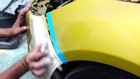 4K Garage Car body work car auto car repair car paint after the accident during the spraying automotive
