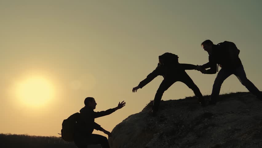 Teamwork. Group of people climbs to top. Helping hand in business. Teamwork concept. Group of people is path to pinnacle of success. Business success. Teamwork is path to pinnacle of success. 