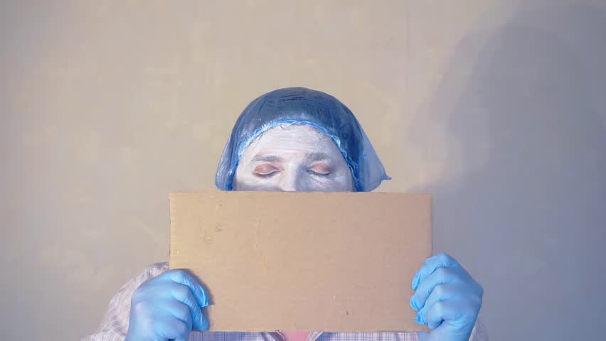 funny mime holds an empty card where you can add your text.actor meme at work.close-up portrait.