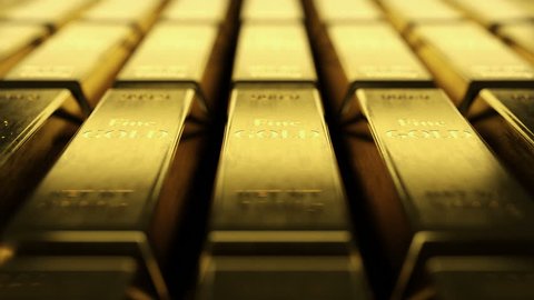 Close-up view of fine gold bars. Loopable video showing rows and rows of fine gold ingots. Camera showing each scratch on fine gold bullion bar surface with shallow depth of field.
