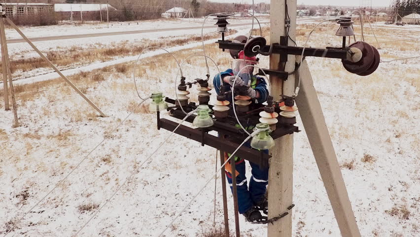 electrician-repairman-working-on-tower-electric-stock-footage-video