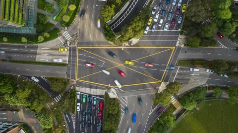 sunny day singapore city traffic street crossroad aerial topdown panorama 4k timelapse