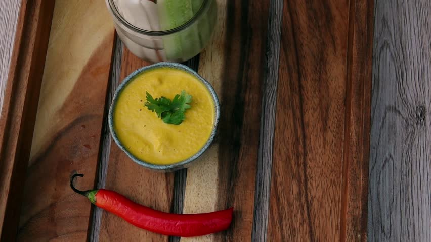 Serving Orange Dip Sauce with Vegetable Sticks on Tray. Top View. Eating Vegan and Vegeterian Food. Lifestyle of Health and Sustainability Concept