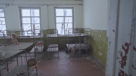 Dolly and Panning Shot of Abandoned Nursery in Chernobyl