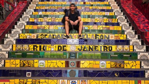Rio de Janeiro, Brazil - May 25: Time lapse view of tourists taking photos at the famous Escadaria Selaron, or Lapa Steps, in Rio de Janeiro, Brazil. : redactionele stockvideo