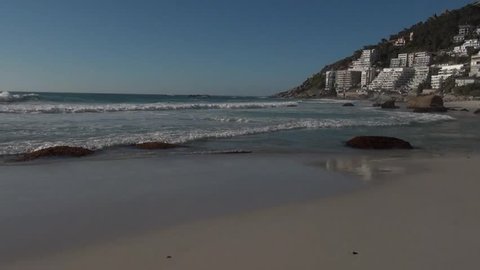 02.12.18: HD high quality summer afternoon video footage of spectacular Clifton Beach, rocks on shore, Atlantic Ocean white sand beach and mountain views in Western Cape near Cape Town, South Africa
