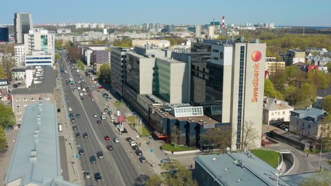 Tallinn / ESTONIA - APRIL 29, 2019: Still shot of Swedbank headquarters with traffic passing by