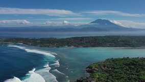 Beach as a background from top view. Waves and azure water as a background. Summer seascape from air. Bali island, Indonesia. Travel - video
