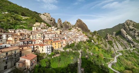 Aerial 4k overview of Castelmezzano mountain village in basilicata region, southern italy, small town with rocks on the background. Time lapse video