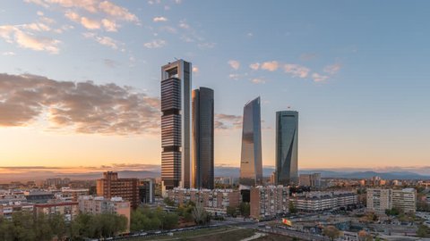 Madrid Spain time lapse 4K, city skyline day to night sunset timelapse at financial district four towers