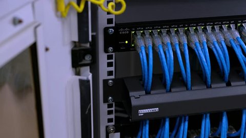 Phatthalung, Thailand April 27, 2019 : Cisco Switch SG200-50. Network gigabit switch and UTP Cat6 Network cable for High speed network. flashing lights.