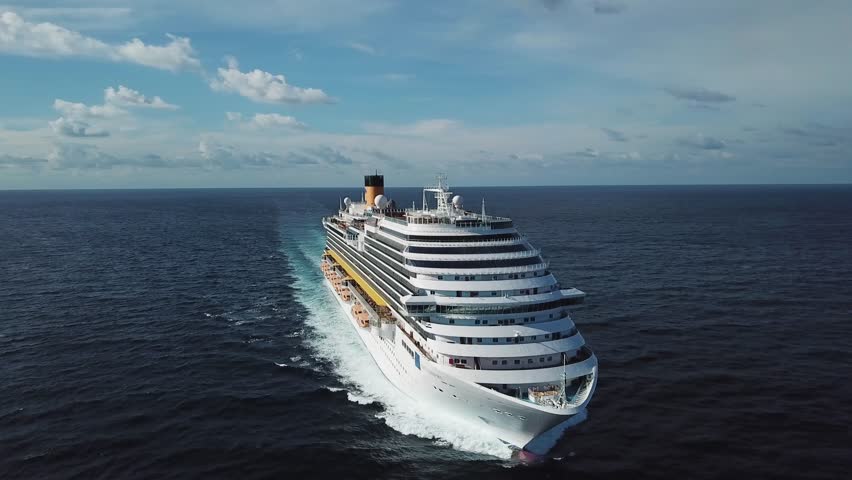 Stunning aerial view of the cruise ship in open water, front view. Stock. Front part of an anchored ocean liner sailing in the Pacific ocean. | Shutterstock HD Video #1028593541