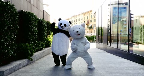 Panda and polar bear dancing in the city to demonstrate and protest against world pollution and animal rights