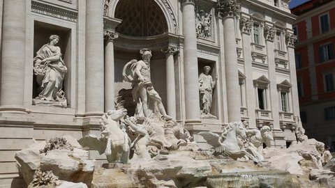 Rome, Italy - April 18, 2019: The famous Trevi Fountain (Fontana di Trevi) and people around at Piazza Trevi, Rome. Built in 1762, designed by Nicola Salvi.