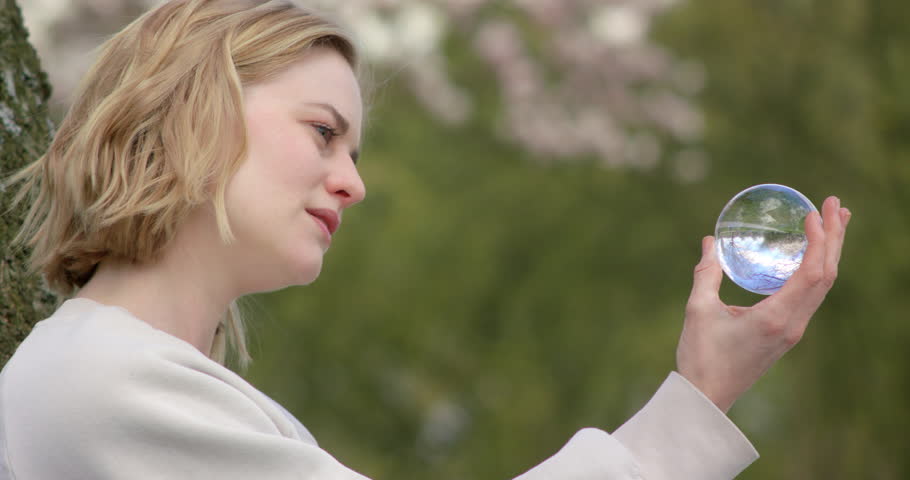 Park landscape reflecting in a glass sphere