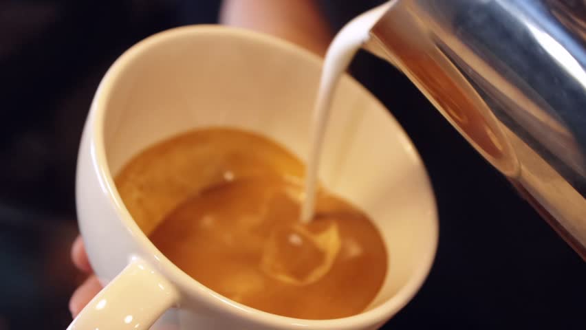 B-Roll of Barista making latte art. Close up of coffee. Lifestyle concept. | Shutterstock HD Video #1028606330