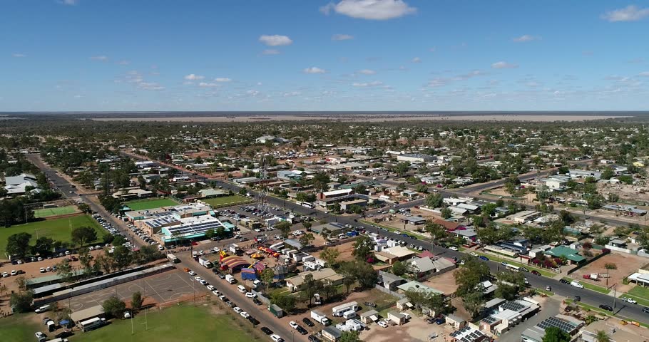Streets of Lightning ridge opal mining town in outback Australia on a sunny dry day – aerial descending down to the ground.
