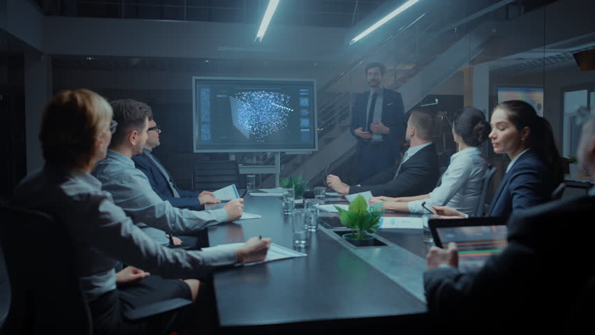 Late at Night in Technological Startup Meeting Room: Chief Engineer Talks Uses Digital Whiteboard to Present New Neural Network, AI, Data Mining Solution to a Board of Investors Royalty-Free Stock Footage #1028612228