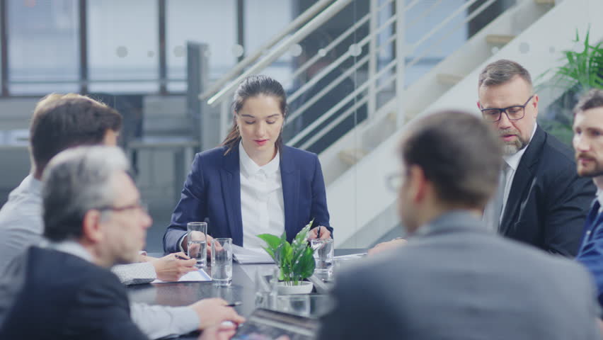 Corporate Meeting Room: Confident Female Executive Director Makes a Report to a Members of the Board and Investors about Company’s Achievement of Record Breaking Annual Revenue Results Royalty-Free Stock Footage #1028612237