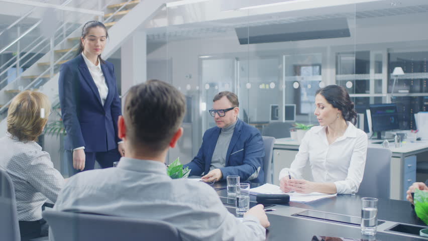 Corporate Meeting Room: Young and Ambitious Female Executive Director Talks to a Board of Directors and Executives about the Need for the Company to Create New Vision and Competitive Market Strategy | Shutterstock HD Video #1028612297