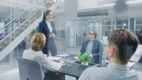 Corporate Meeting Room: Young and Ambitious Female Executive Director Delivers Powerful Speech About Company’s Achievement of Record-Breaking Annual Revenue Results to a Board of Executives, Investors
