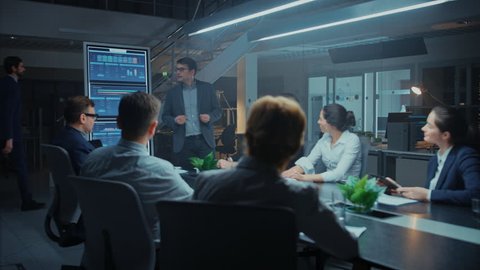 In the Corporate Meeting Room: Energetic and Confident Young Startup Creator Uses Digital Interactive Whiteboard for Presentation and Delivers Powerful Speech to a Board of Executives Investors