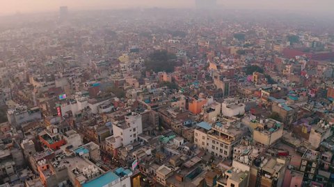India, Delhi city center slums roofs aerial 4k drone footage, evening dusk