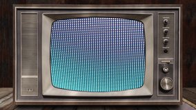 Vintage television on wooden table with LED Screen background