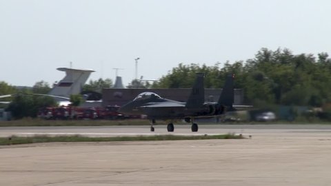 Zhukovsky, Russia, August 18, 2011. US all-weather fighter F-15 Eagle turns around and leaves runway. F-15 Eagle continues taxiing in parking direction. View of back of hemisphere.