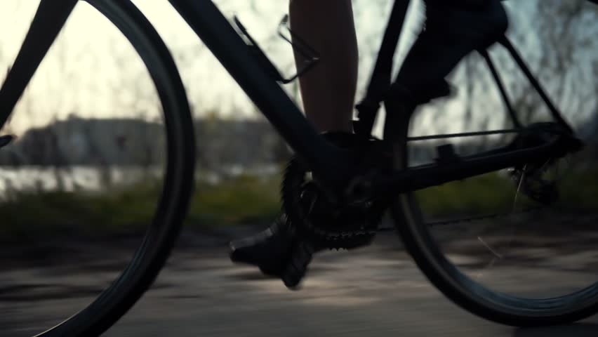 Cyclist Training Leisure Twists Pedals On Triathlon Bicycle.Gear System 
And Bike Wheel.Cycling Gear Athlete Workout.Sport Healthy Lifestyle Fitness Vacation.Cyclist Pedaling Bike Endurance Exercising Royalty-Free Stock Footage #1028623427