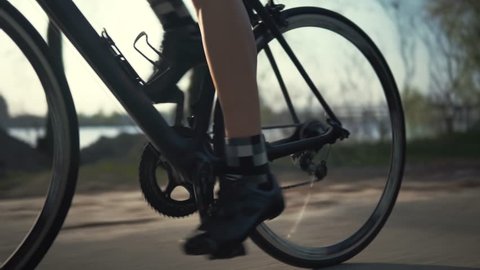 Cyclist Training Leisure Twists Pedals On Triathlon Bicycle.Gear System 
And Bike Wheel.Cycling Gear Athlete Workout.Sport Healthy Lifestyle Fitness Vacation.Cyclist Pedaling Bike Endurance Exercising
