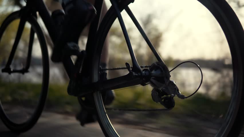 Cyclist On Bike Cycling And Pedaling Sport Recreation.Gear System Bicycle And Bike Wheel Rotation.Fitness Cyclist Twists Pedals Riding Triathlon Road Bike.Cycling Gear Athlete Workout.Sport Recreation Royalty-Free Stock Footage #1028623436