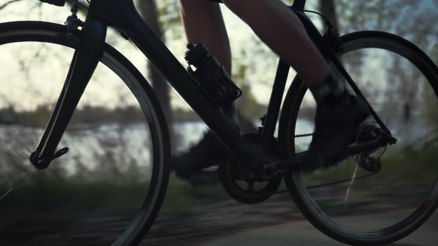 Cyclist Triathlete Twist Pedals And Riding Road Bicycle.Cycling Athlete Sport Recreation Workout Fitness Cycling Training.Gear System And Road Bike Wheel Rotation.Triathlon Cyclist Exercising Pedaling Royalty-Free Stock Footage #1028623439