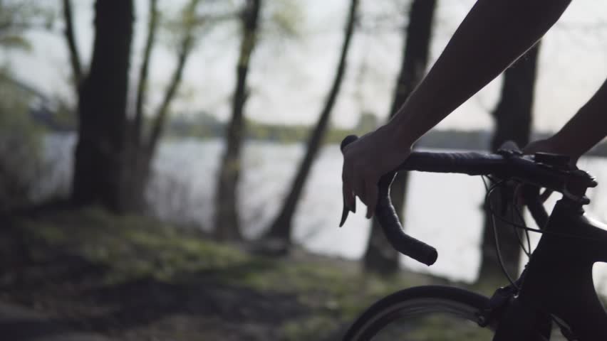 Athlete Shifting Bike Gear.Cyclist Workout Riding.Sport Concept.Cycling And Changing Gear Shifter And Brake On Triathlon Bike.Bicycle Handlebar Stem And Wheel.Cyclist Triathlete Hold Road Handlebar Royalty-Free Stock Footage #1028623469