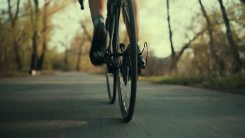 Cyclist Training Leisure Twists Pedals On Triathlon Bicycle.Bike Wheel And Legs.Cycling Gear Athlete Workout.Sport Healthy Lifestyle Fitness Vacation Cycling.Cyclist Pedaling Bike Endurance Exercising Royalty-Free Stock Footage #1028623484