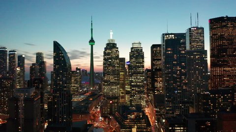 29.98P dusk flying right view of Toronto skyline