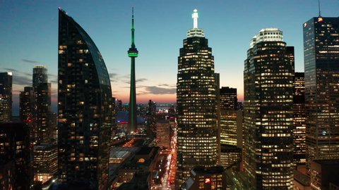 29.98P dusk flying backward view of Toronto skyline