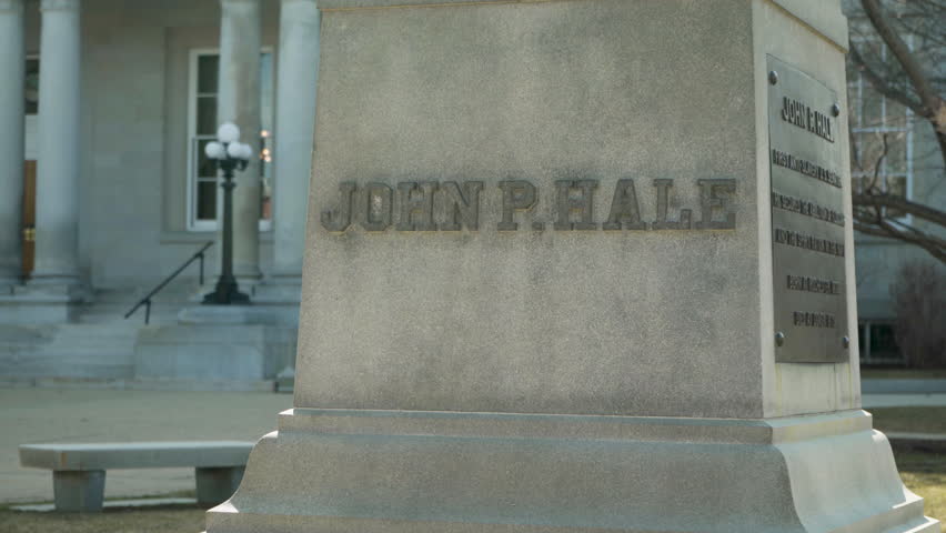 Long rising shot of historic statue of New Hampshire politician, senator, and representative John P. Hale