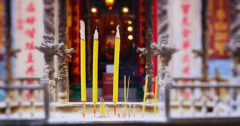 Close up of Incense Burning Buddhist Temple Religious Mysterious Beautiful in beautiful Hong kong China Asia. Slow motion, shot on red camera. Note: No Visible faces / people.