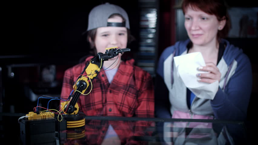 4k Child Boy Giving his Mum a Tissue with Robotic Arm