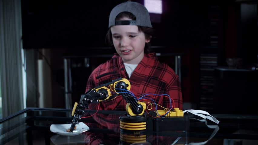 4k Child Boy Feeding the Dog with Robotic Arm
