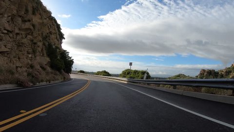 Los Angeles canyon driving above the San Fernando Valley on Santa Susana Pass Road in Southern California.