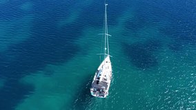 Aerial drone video of beautiful sail boat cruising the Aegean sea, Greece