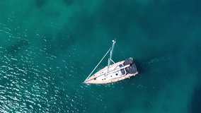 Aerial drone video of beautiful sail boat cruising the Aegean sea, Greece