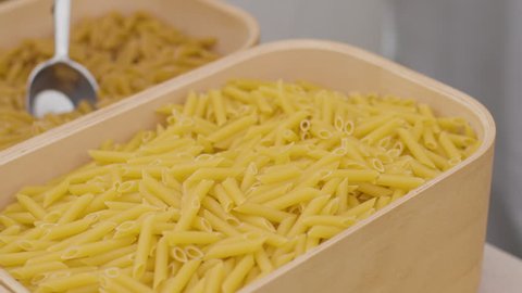 pulling in sweeping shot of loose pasta with no packaging