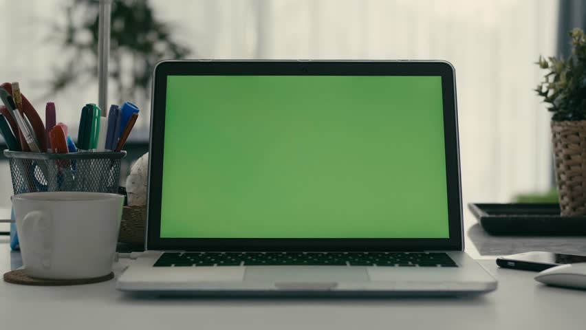 Desk working at home on with laptop green screen | Shutterstock HD Video #1028646647